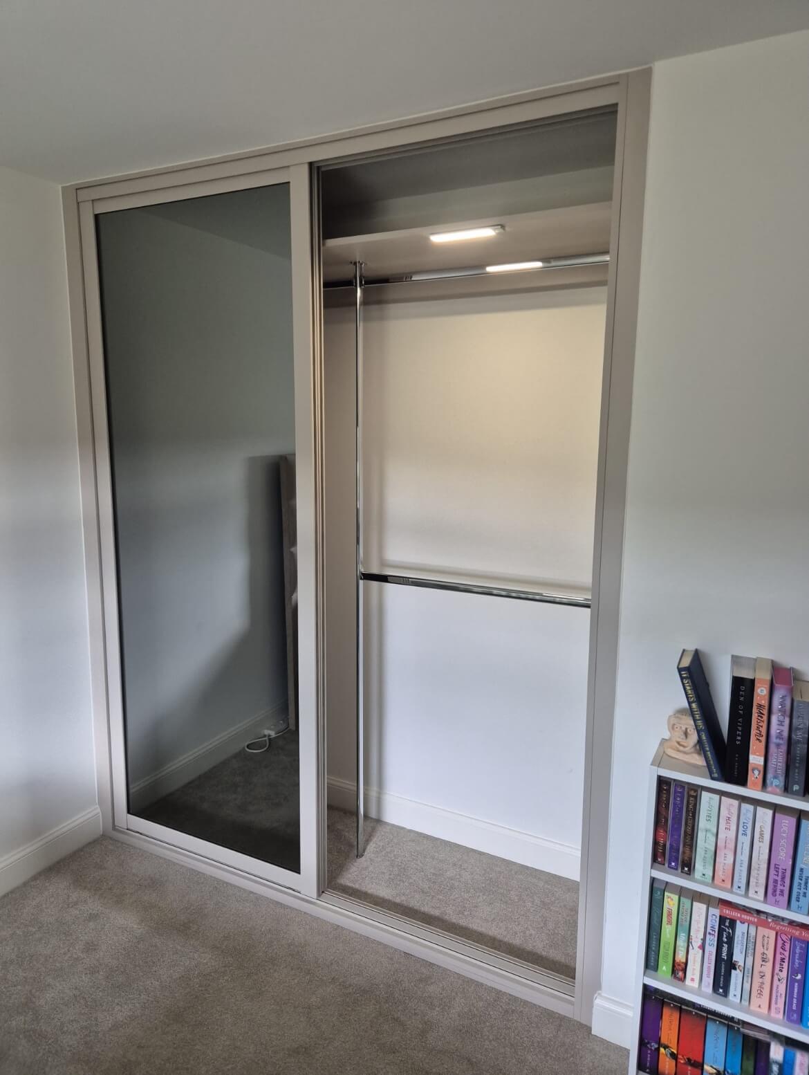 Inside the same style of wardrobe — double hanging rails that double the space for shirts, jackets and trousers.