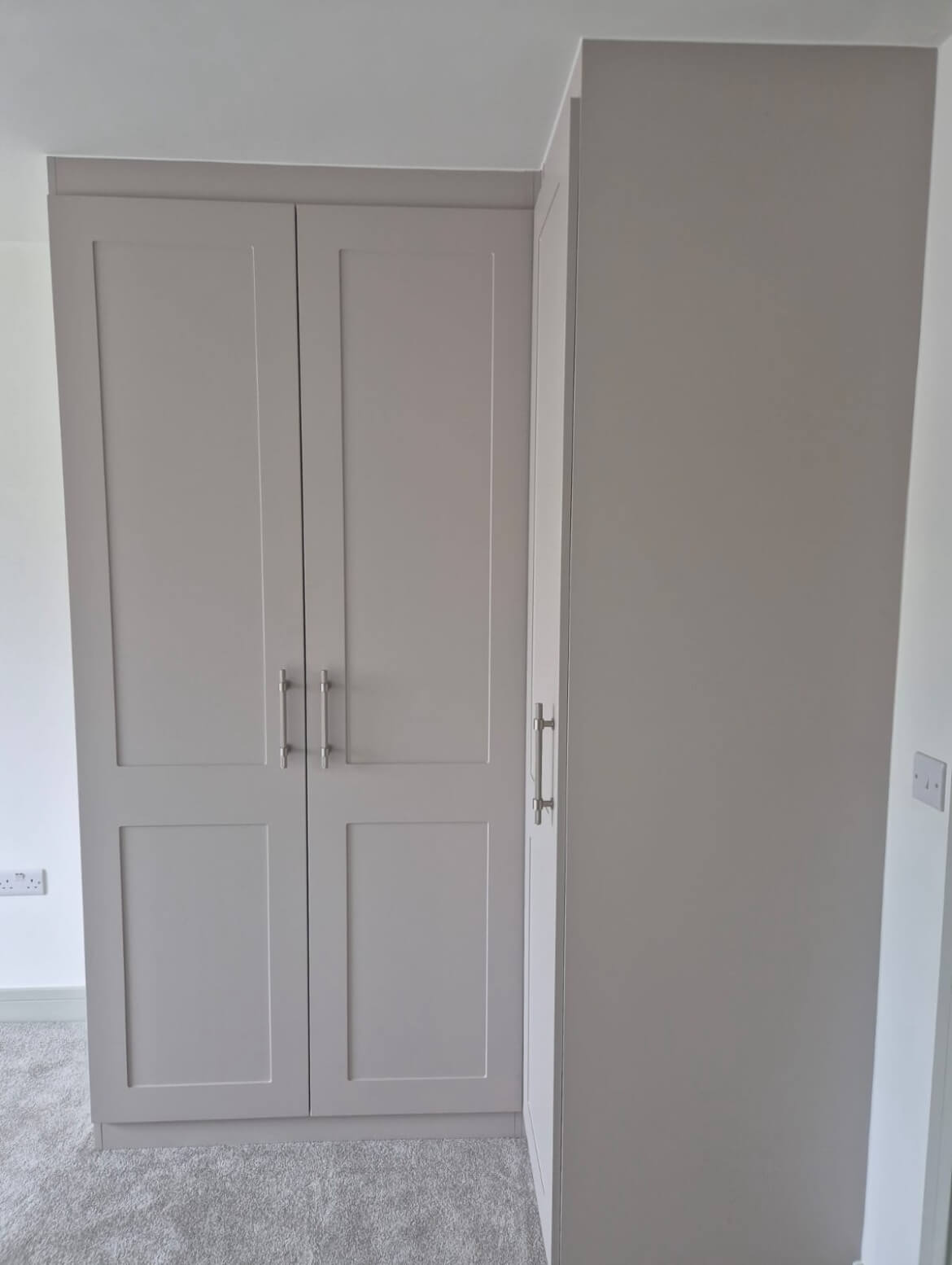 Grey shaker corner fitted wardrobe in a Boldmere, Sutton Coldfield new-build bedroom