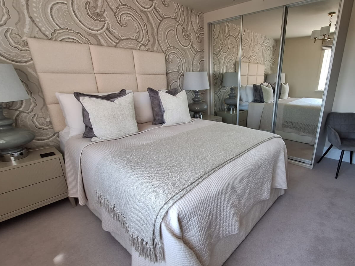 Double bedroom in Tamworth with three FORM silver mirror sliding wardrobe doors along the side wall