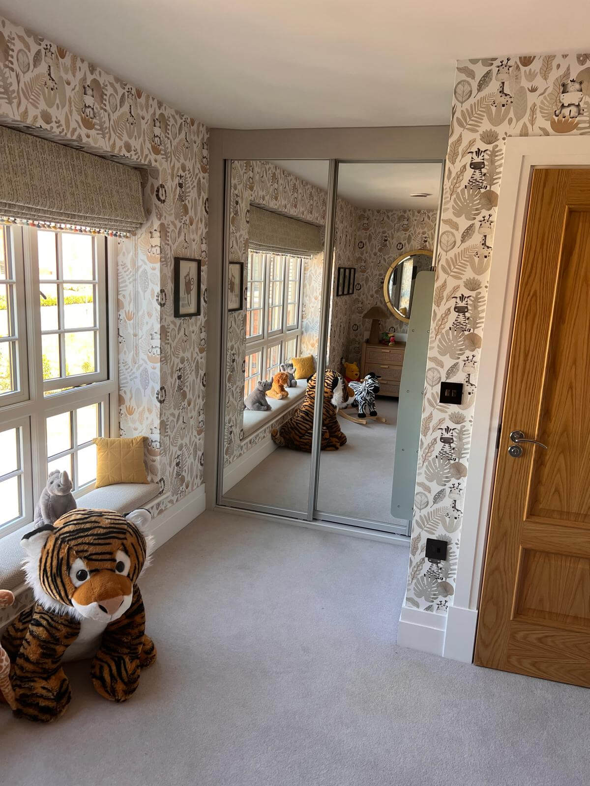 Two FORM mirror sliding doors spanning an alcove wall to wall in a child's bedroom in Tamworth