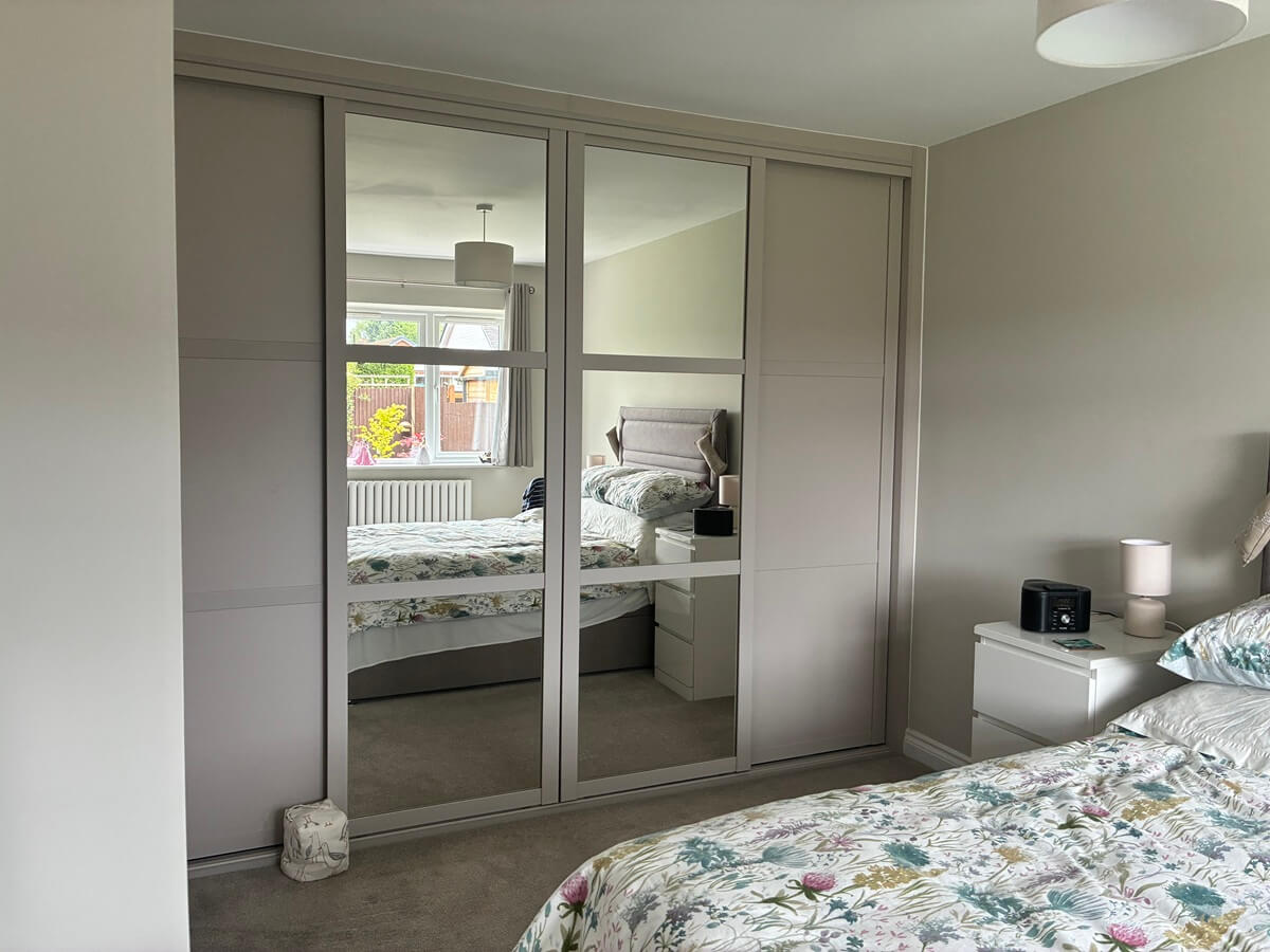 Cashmere-framed sliding wardrobe with silver mirror shaker-style doors, fitted in a Bloxwich bedroom, Walsall, by Vesta Space