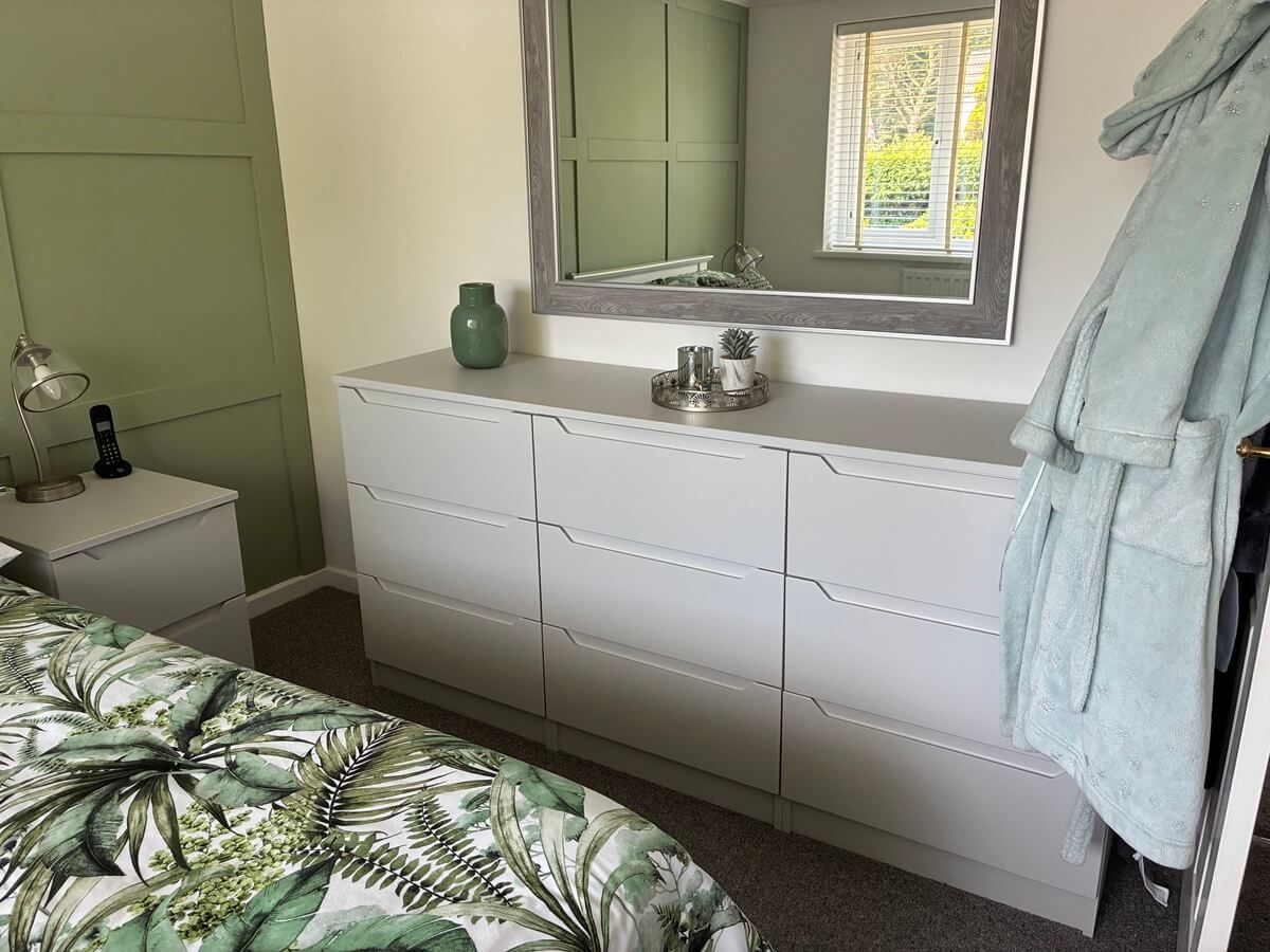 Matching fitted chest of drawers with a wall mirror, coordinated with the fitted wardrobes in a Walsall bedroom