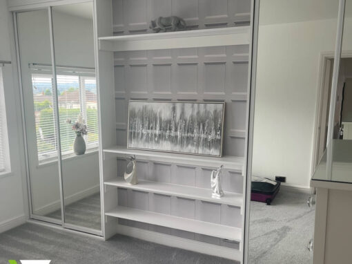 White fitted wardrobe with FORM silver mirror doors and open shelving built around a chimney breast