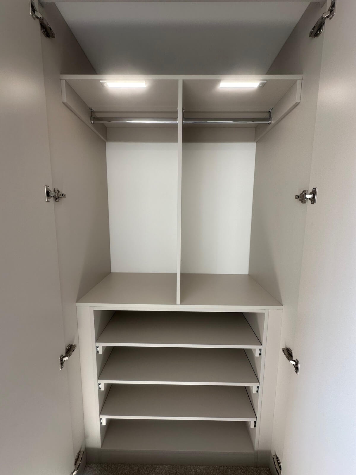 Hinged wardrobe interior with built-in LED lighting, hanging rail and open shelving, Gloucester
